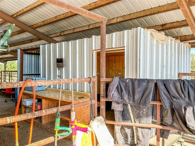 a view of a house with backyard porch and sitting area