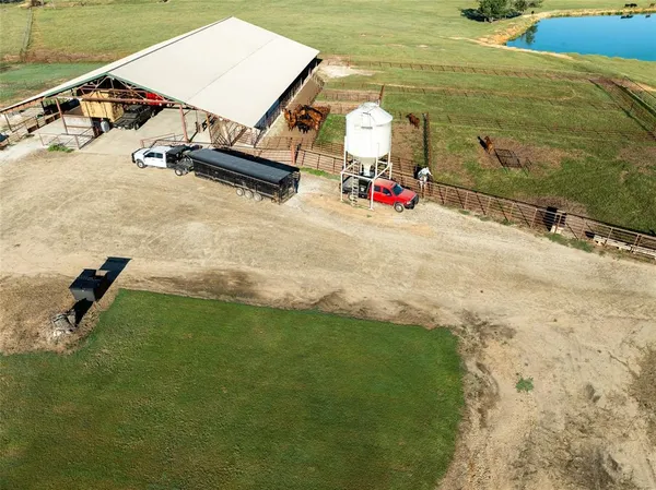 a view of a swimming pool with a yard