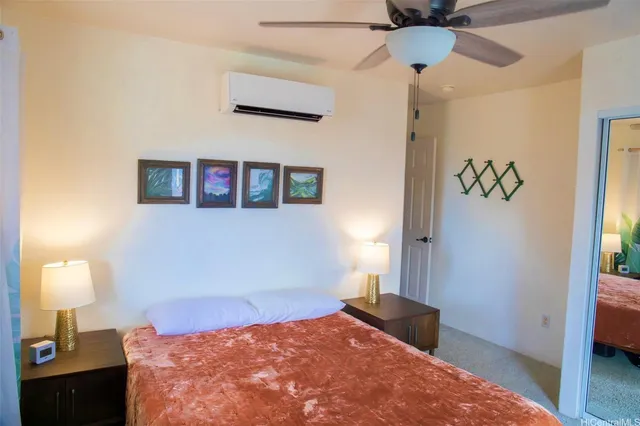 a bedroom with a bed and a lamp