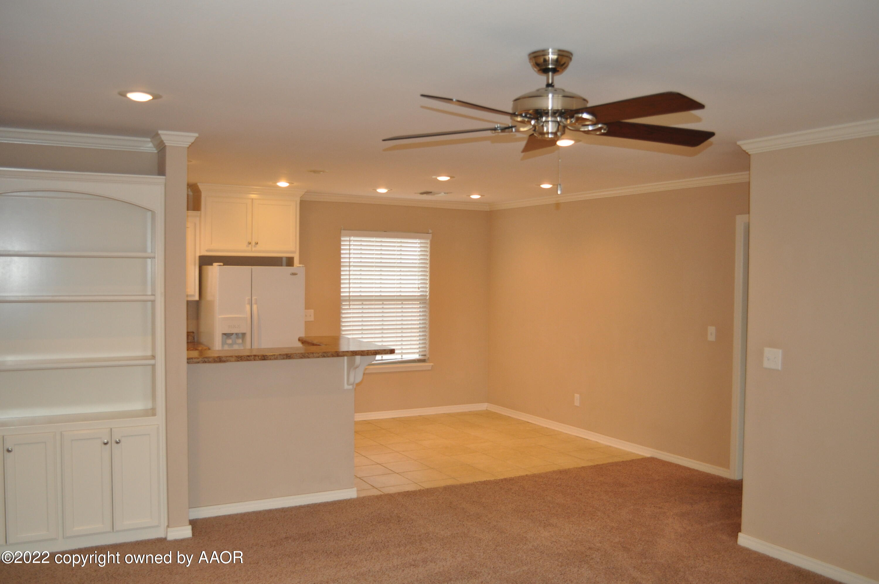 601 B 5th Street Canyon, TX 79015 - Photo 3 of 16 a view of a livingroom with a chandelier fan and kitchen view