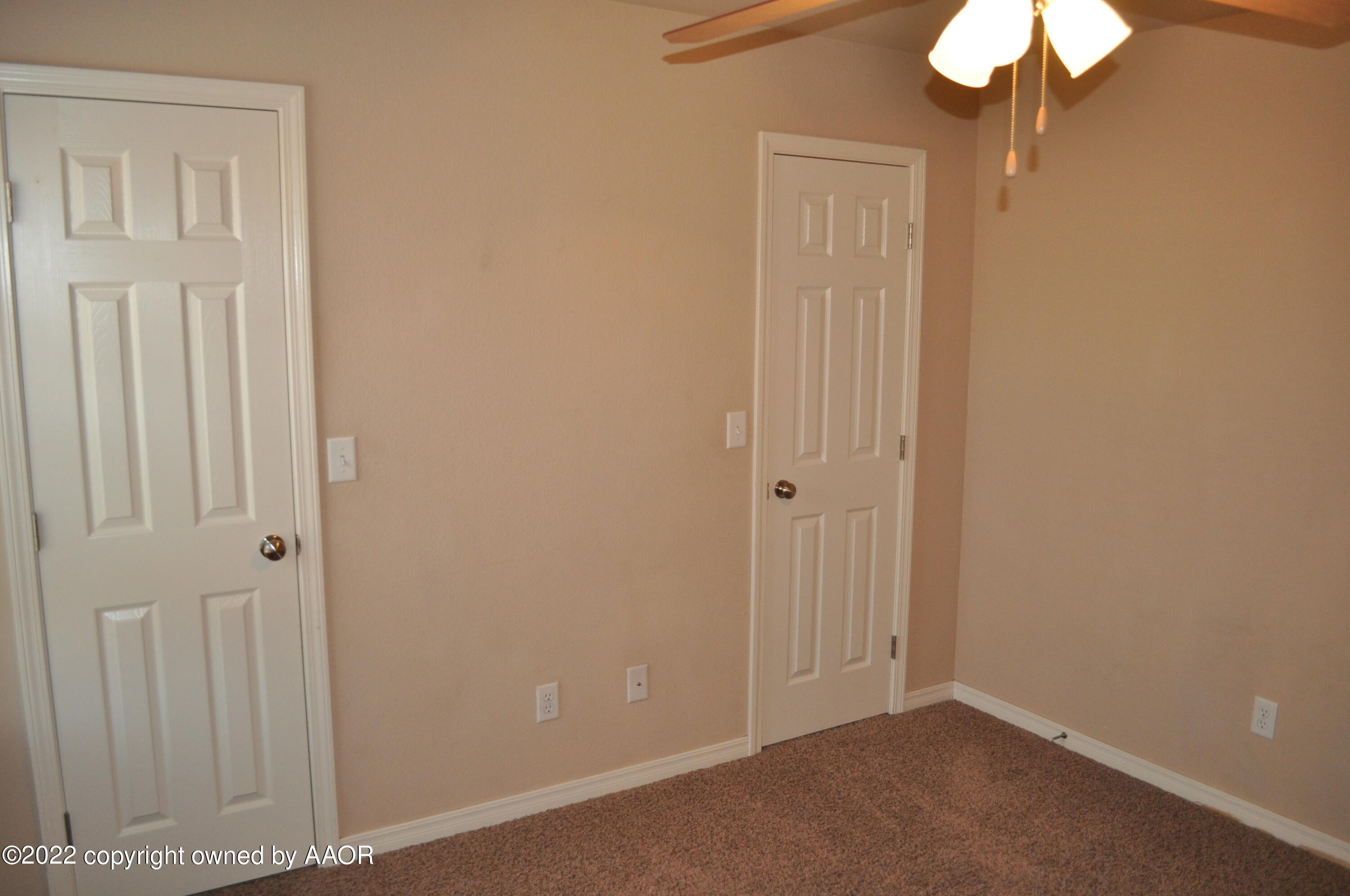 601 B 5th Street Canyon, TX 79015 - Photo 9 of 16 an empty room with a chandelier fan