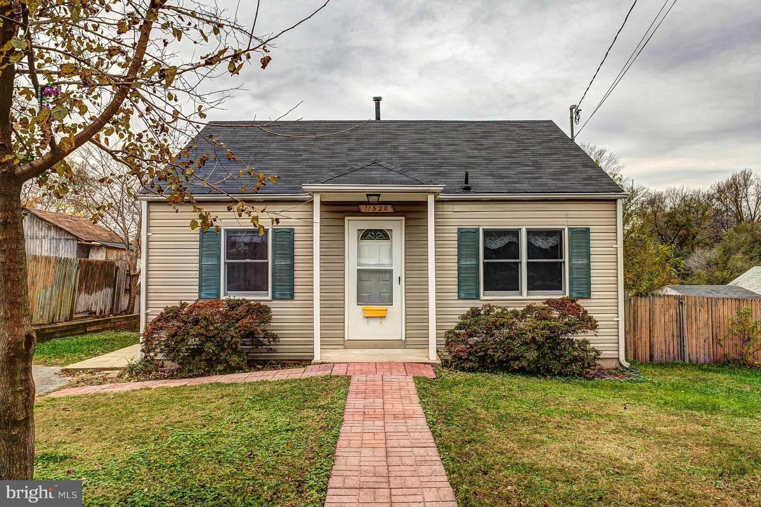 11520 Joseph Mill Road Silver Spring, MD 20906 - Photo 1 of 30 a front view of a house with garden