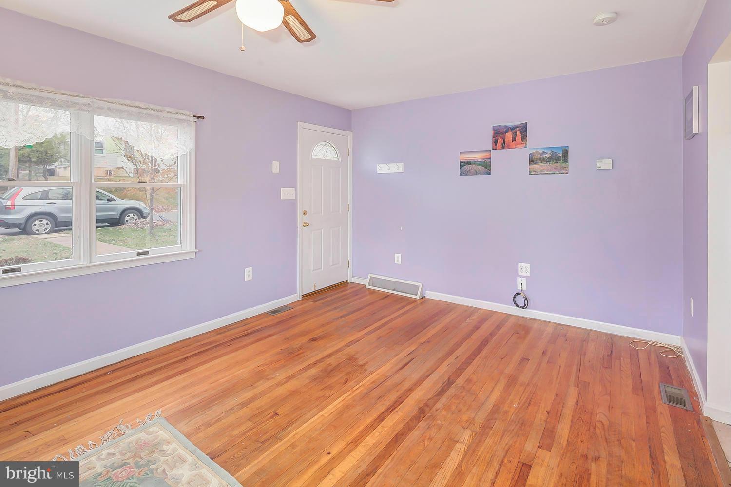 11520 Joseph Mill Road Silver Spring, MD 20906 - Photo 2 of 30 a view of empty room with wooden floor and fan