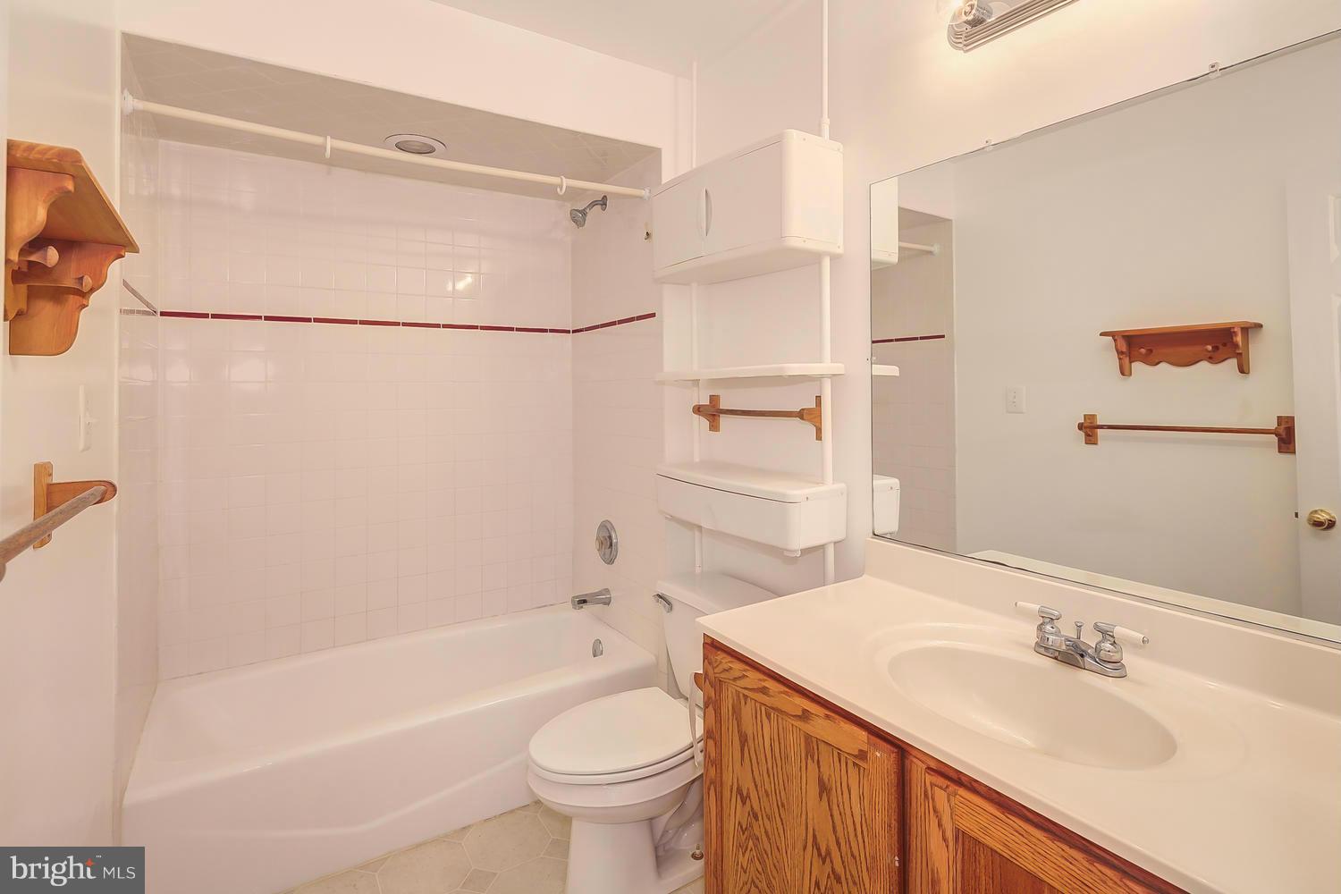 11520 Joseph Mill Road Silver Spring, MD 20906 - Photo 14 of 30 a bathroom with a sink toilet and shower