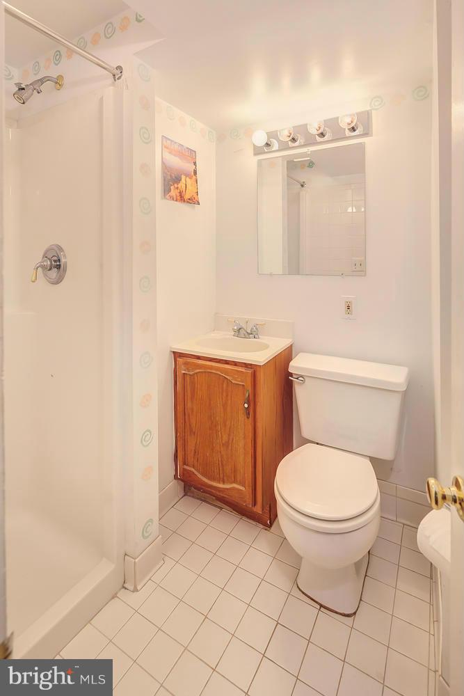 11520 Joseph Mill Road Silver Spring, MD 20906 - Photo 19 of 30 a bathroom with a toilet a sink and shower
