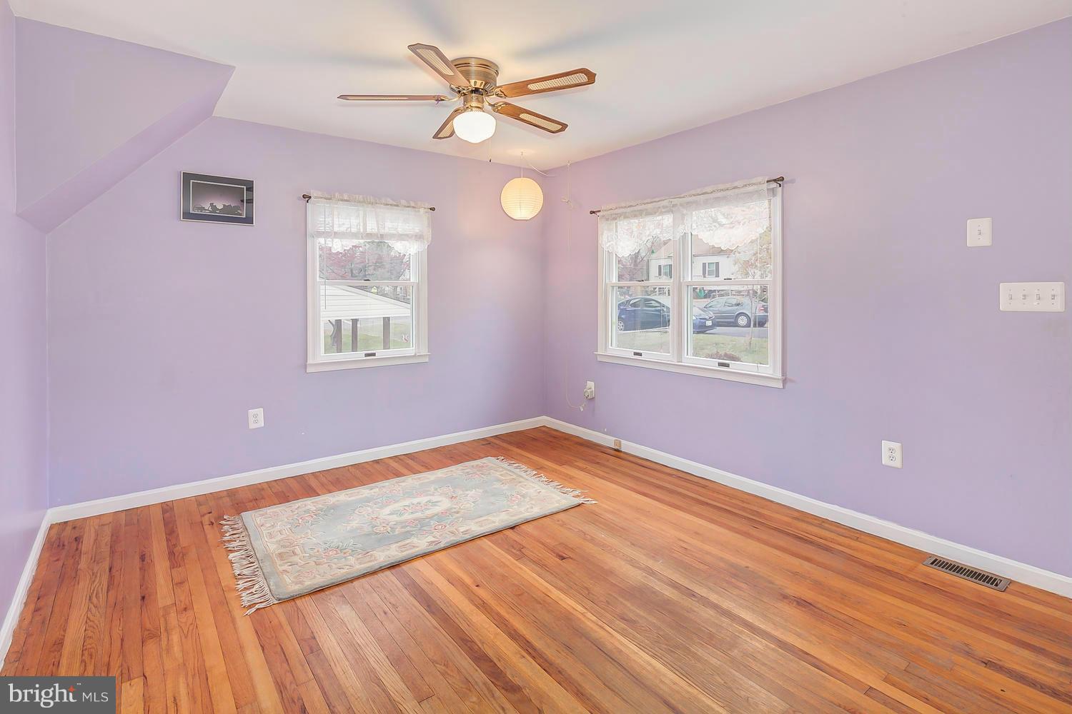 11520 Joseph Mill Road Silver Spring, MD 20906 - Photo 3 of 30 a view of an empty room with wooden floor and a window