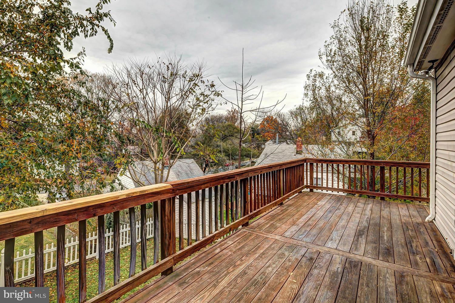 11520 Joseph Mill Road Silver Spring, MD 20906 - Photo 23 of 30 a balcony with wooden floor and fence