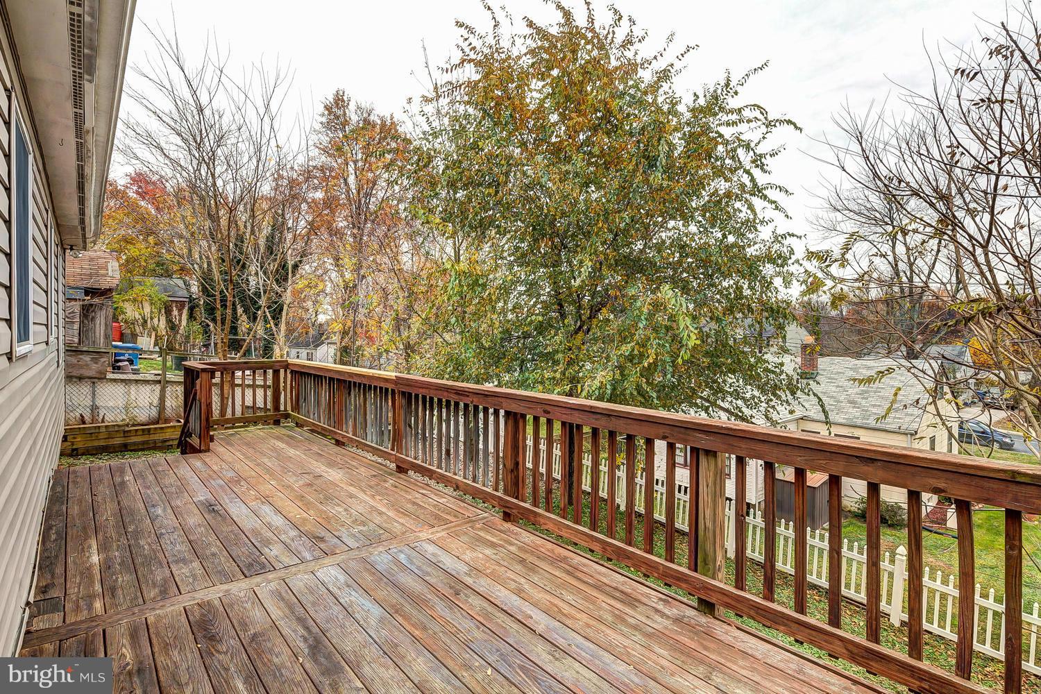 11520 Joseph Mill Road Silver Spring, MD 20906 - Photo 24 of 30 a view of balcony with wooden floor and fence