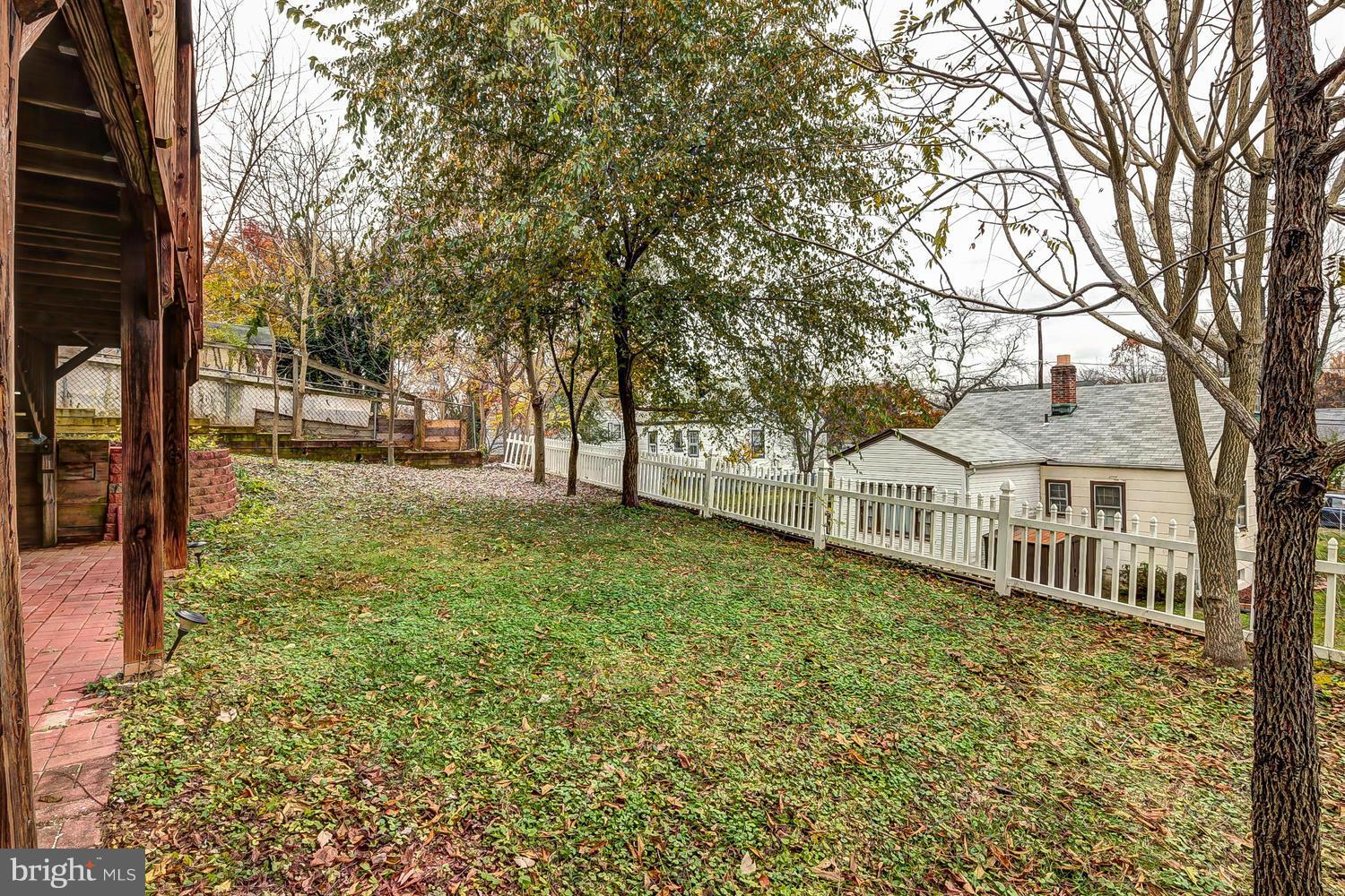 11520 Joseph Mill Road Silver Spring, MD 20906 - Photo 26 of 30 a view of a house with a yard and deck