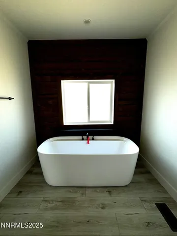 a bath tub sitting in a bathroom