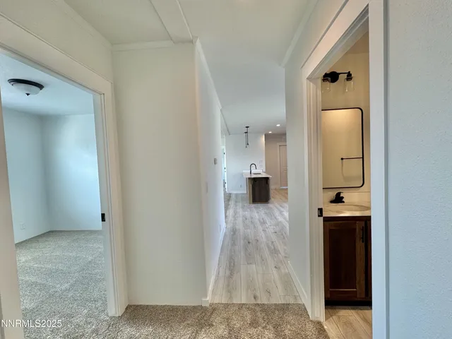 a bathroom with a sink and mirror