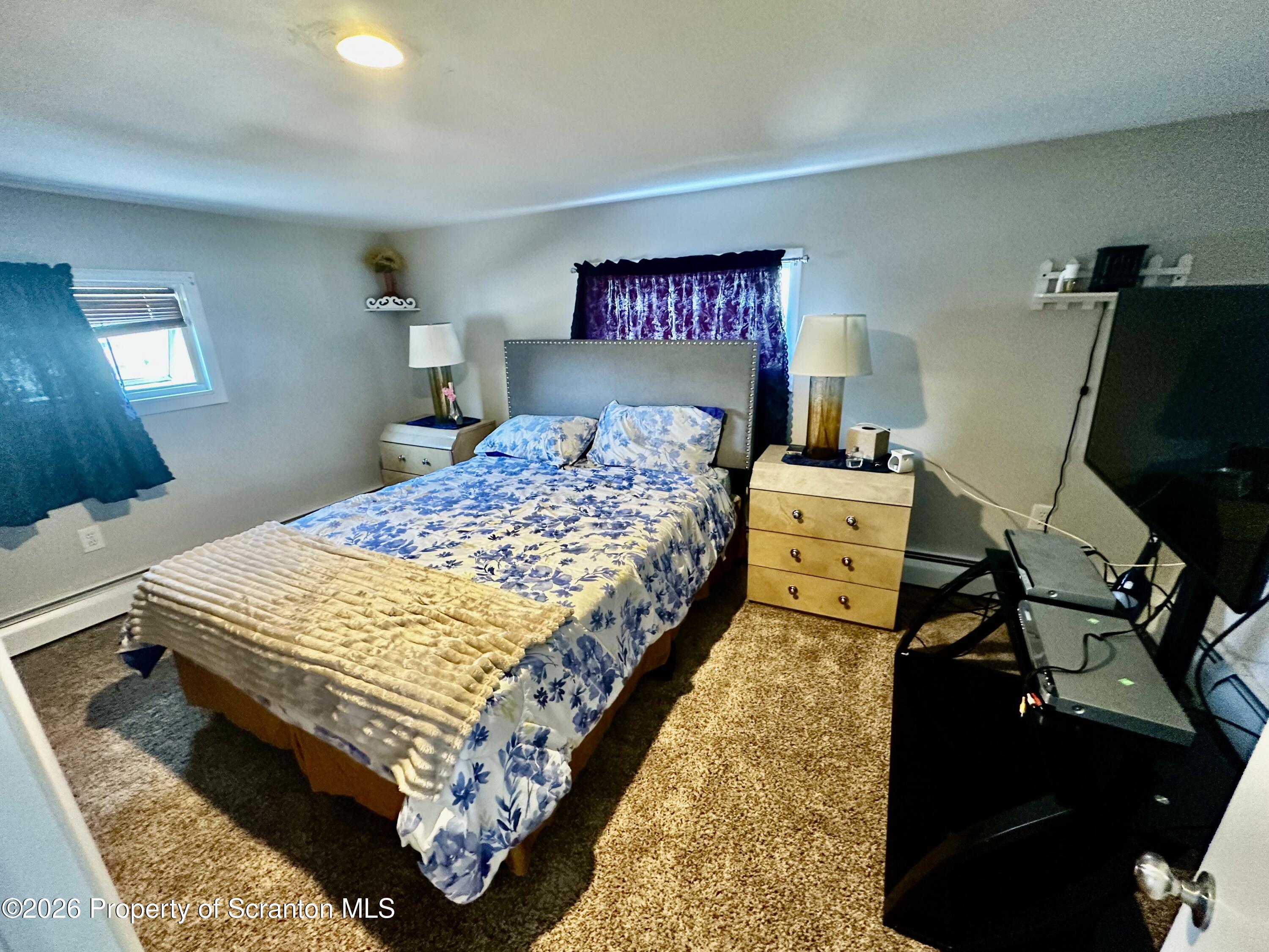1727 Bulwer Street Scranton, PA 18504 - Photo 27 of 40 a bedroom with a bed and wooden floor