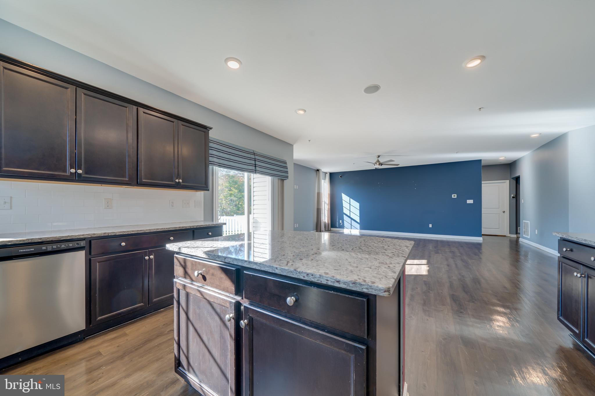 800 Naeve Court Accokeek, MD 20607 - Photo 13 of 56 a kitchen with stainless steel appliances granite countertop wooden cabinets a sink and dishwasher