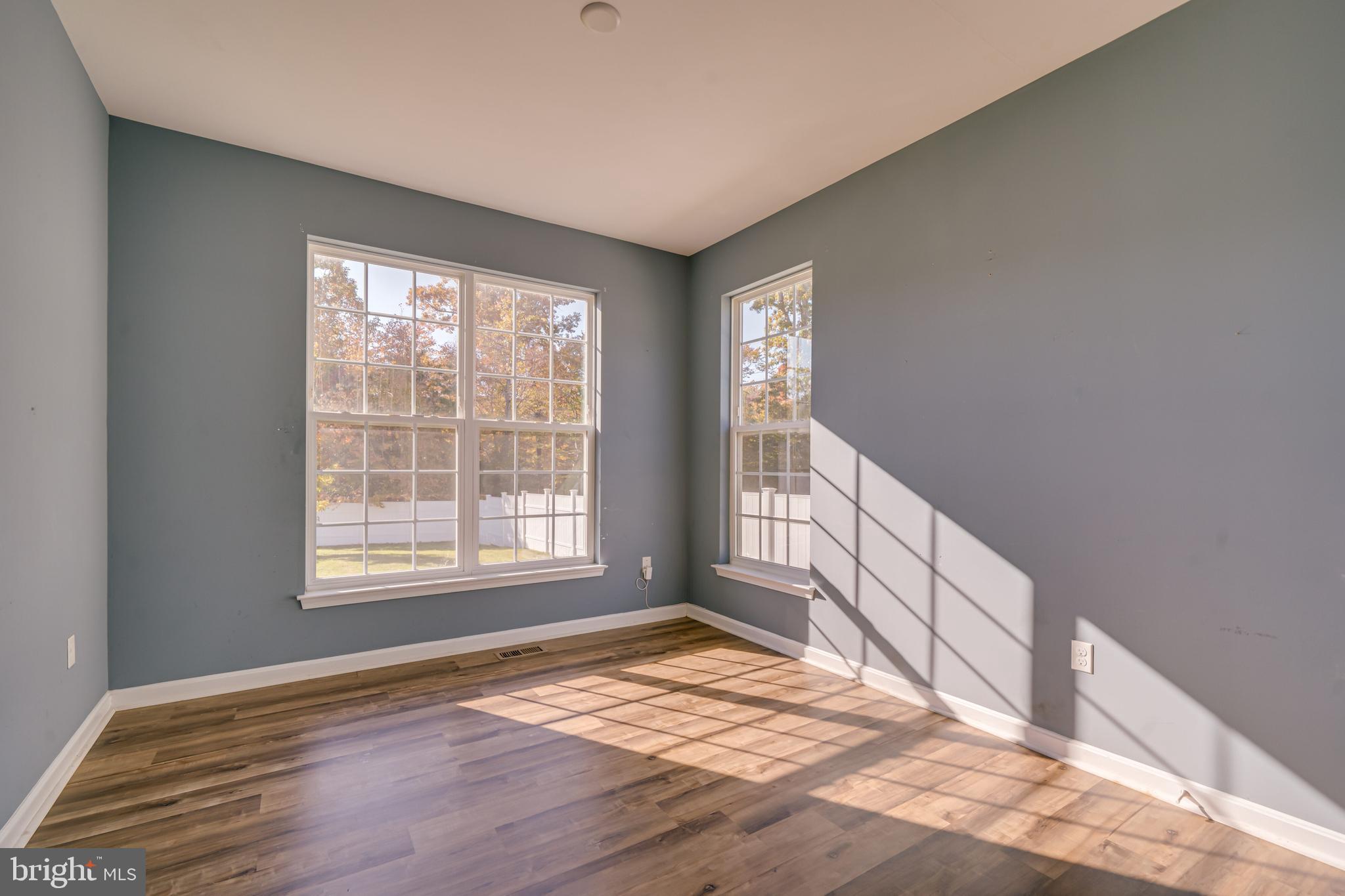 800 Naeve Court Accokeek, MD 20607 - Photo 16 of 56 a view of an empty room with wooden floor and a window