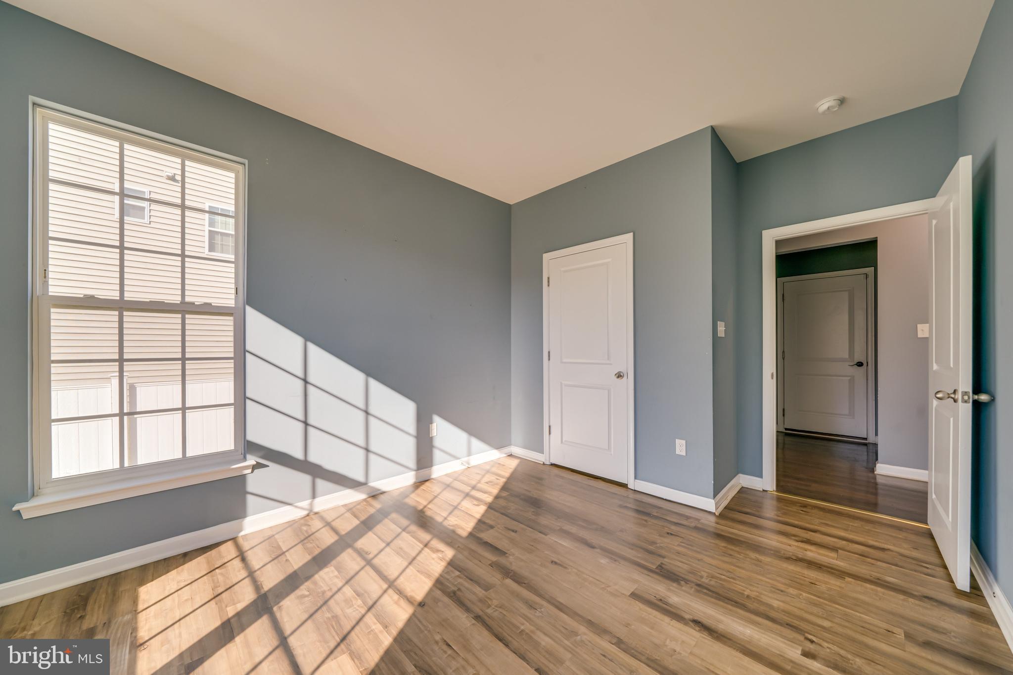 800 Naeve Court Accokeek, MD 20607 - Photo 17 of 56 a view of a bedroom with wooden floor and windows
