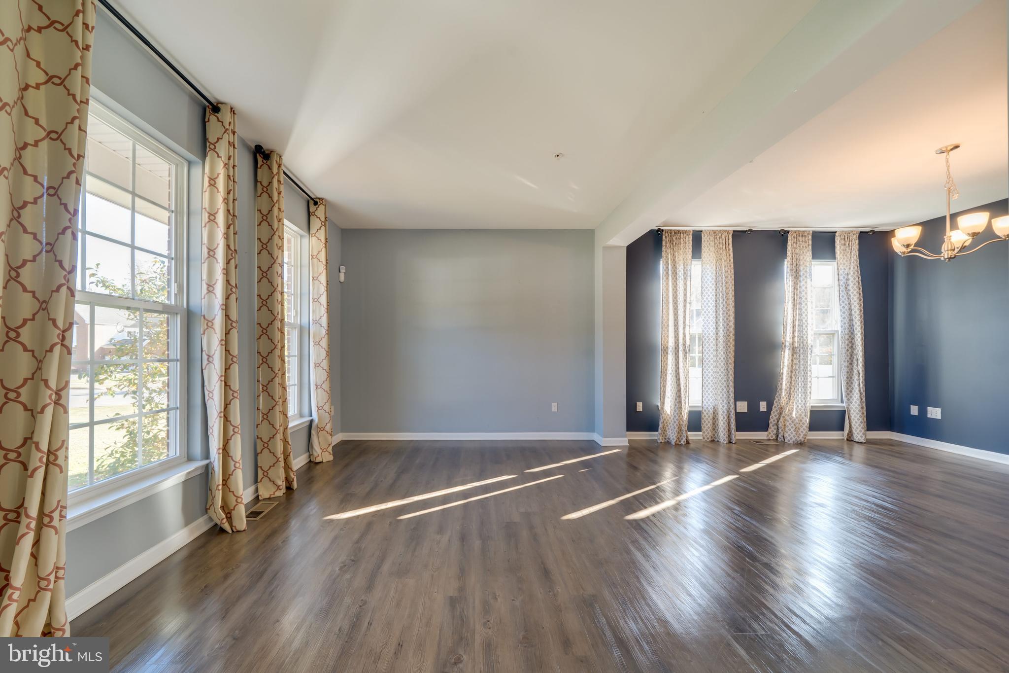 800 Naeve Court Accokeek, MD 20607 - Photo 2 of 56 an empty room with wooden floor and windows