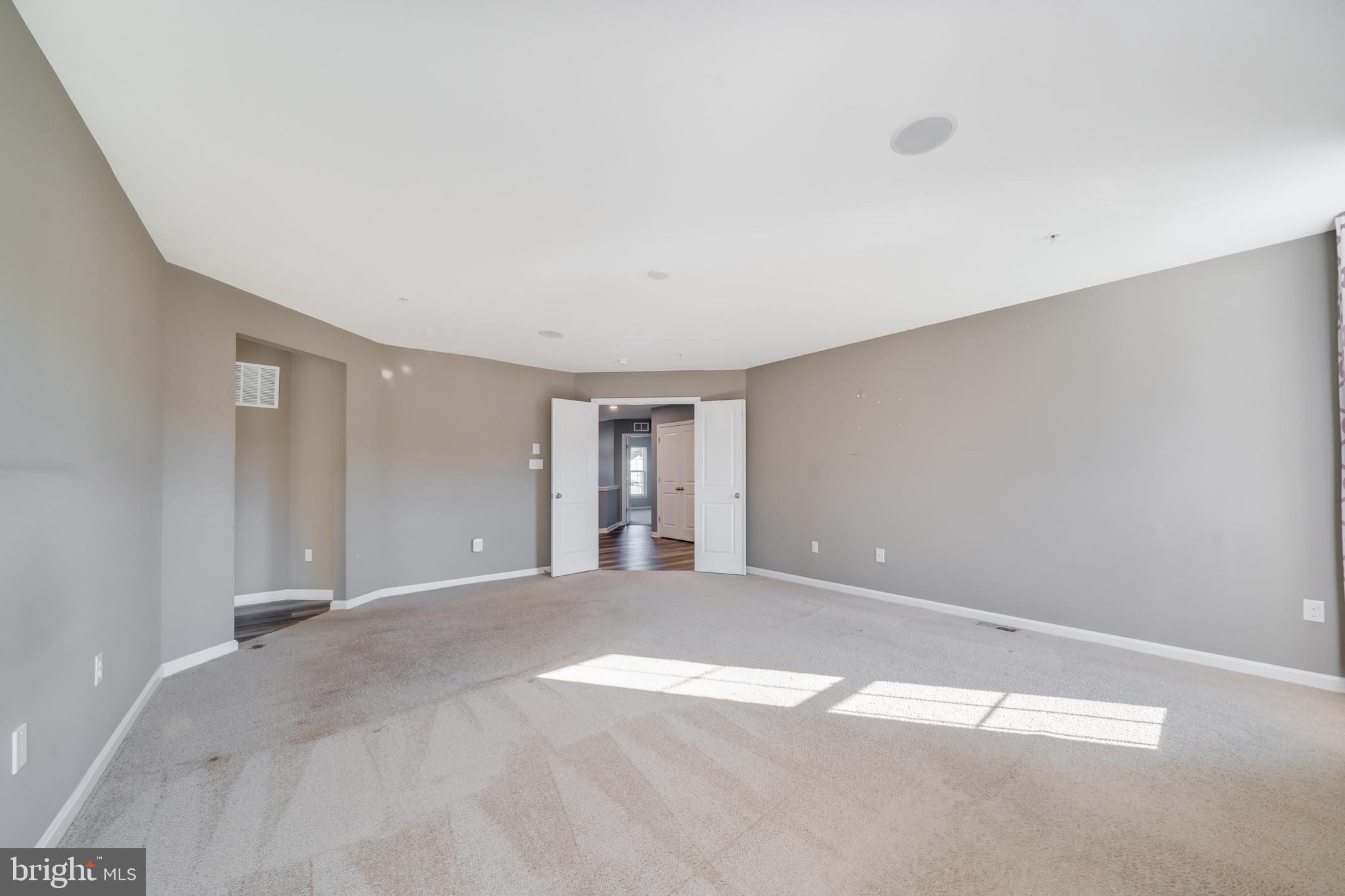800 Naeve Court Accokeek, MD 20607 - Photo 27 of 56 a view of an empty room with window and chandelier fan