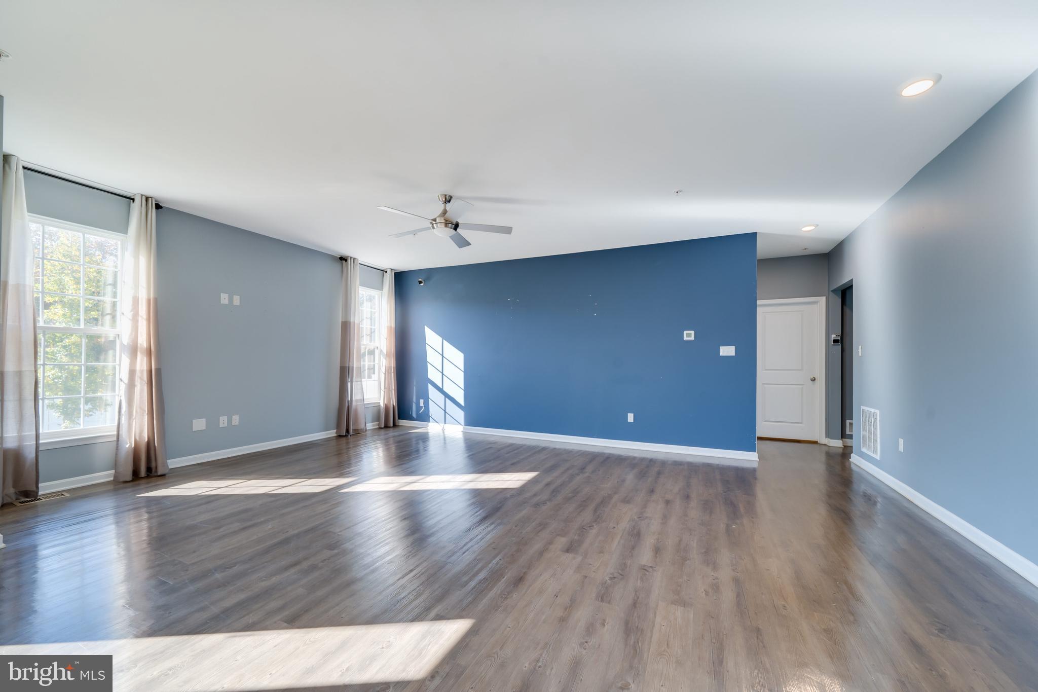 800 Naeve Court Accokeek, MD 20607 - Photo 4 of 56 a view of an empty room with wooden floor and a window