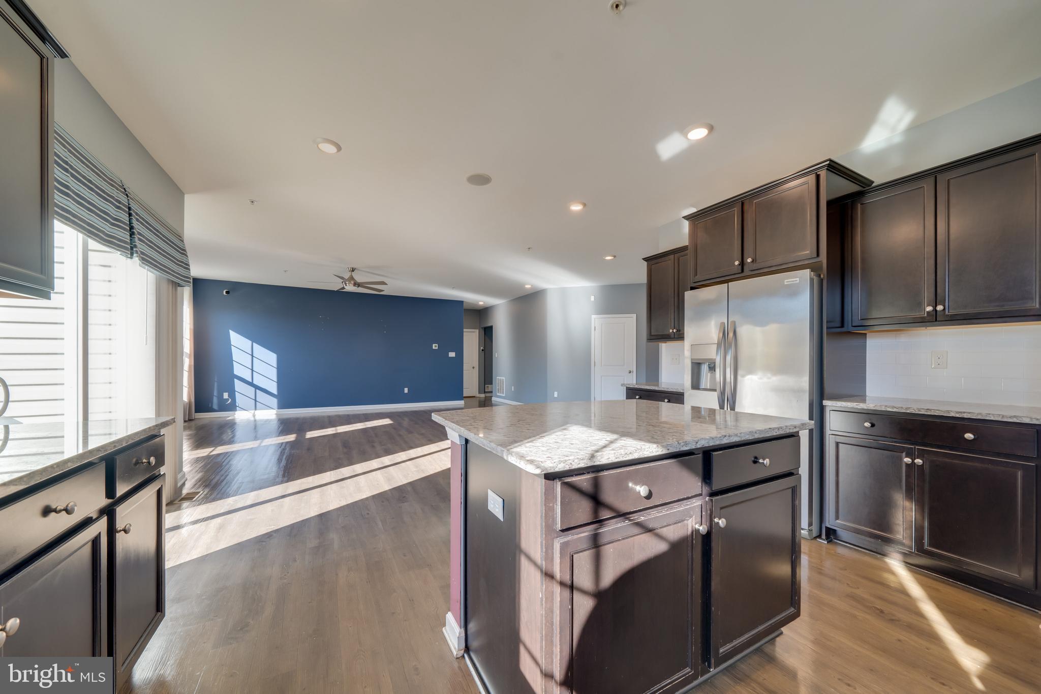 800 Naeve Court Accokeek, MD 20607 - Photo 9 of 56 a kitchen with stainless steel appliances granite countertop a sink a stove and a refrigerator