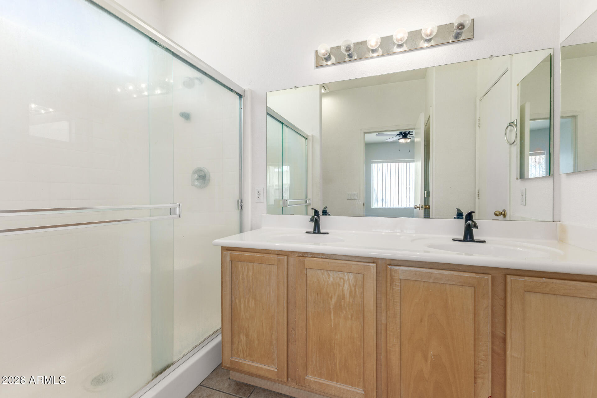 256 North 110th Street Apache Junction, AZ 85120 - Photo 14 of 27 a bathroom with a double vanity sink and mirror