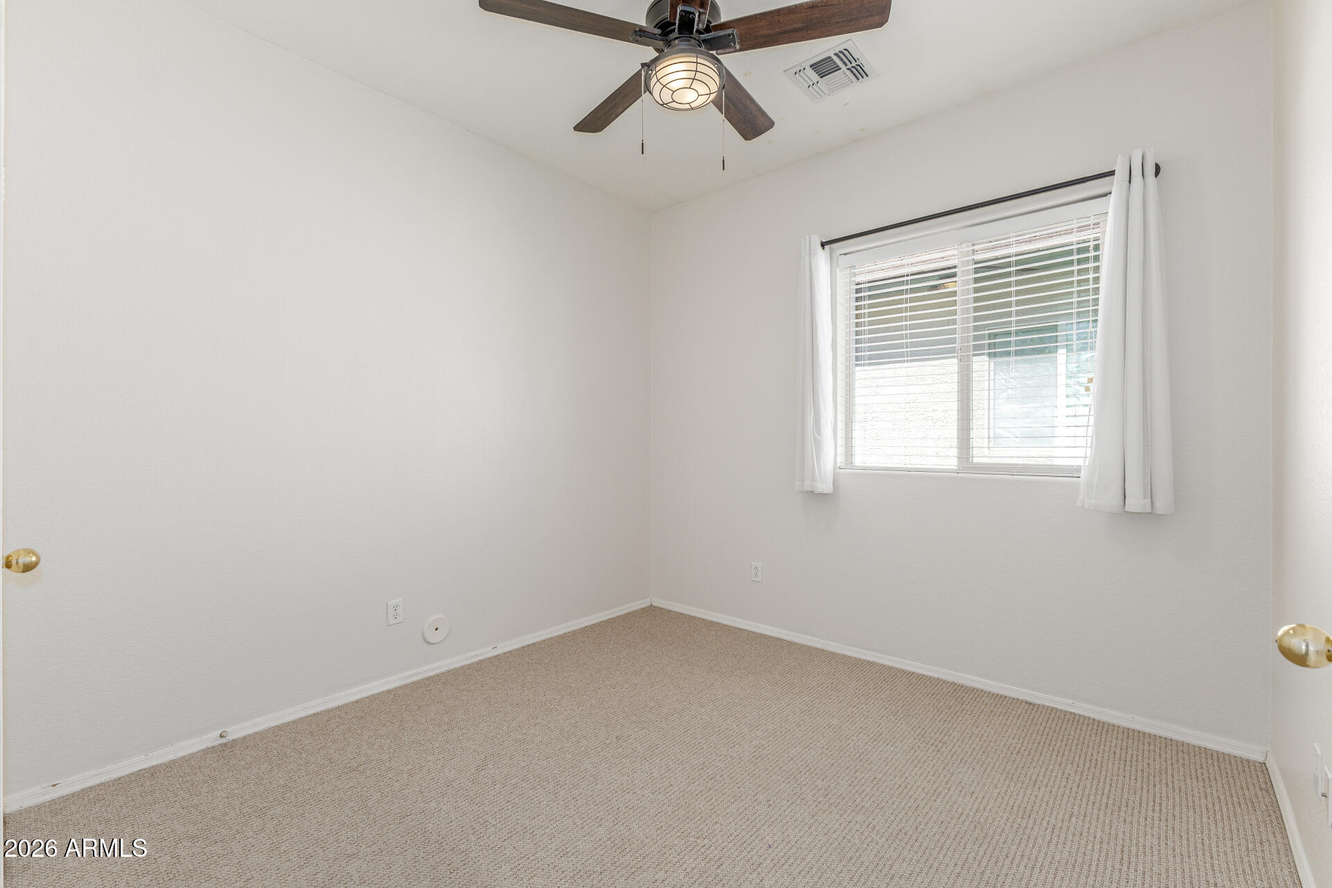 256 North 110th Street Apache Junction, AZ 85120 - Photo 18 of 27 a view of a window in a room