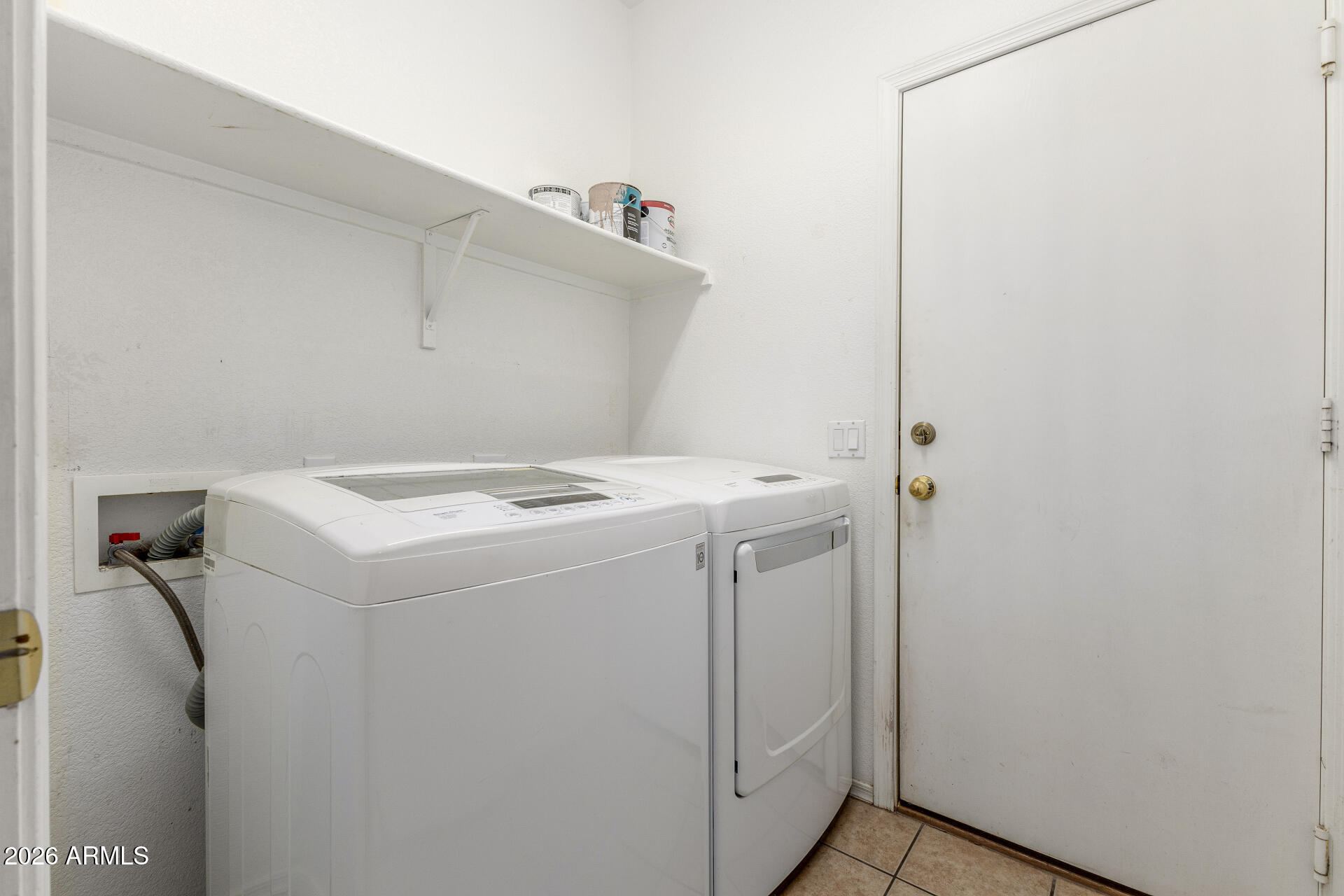 256 North 110th Street Apache Junction, AZ 85120 - Photo 21 of 27 a utility room with dryer and washer