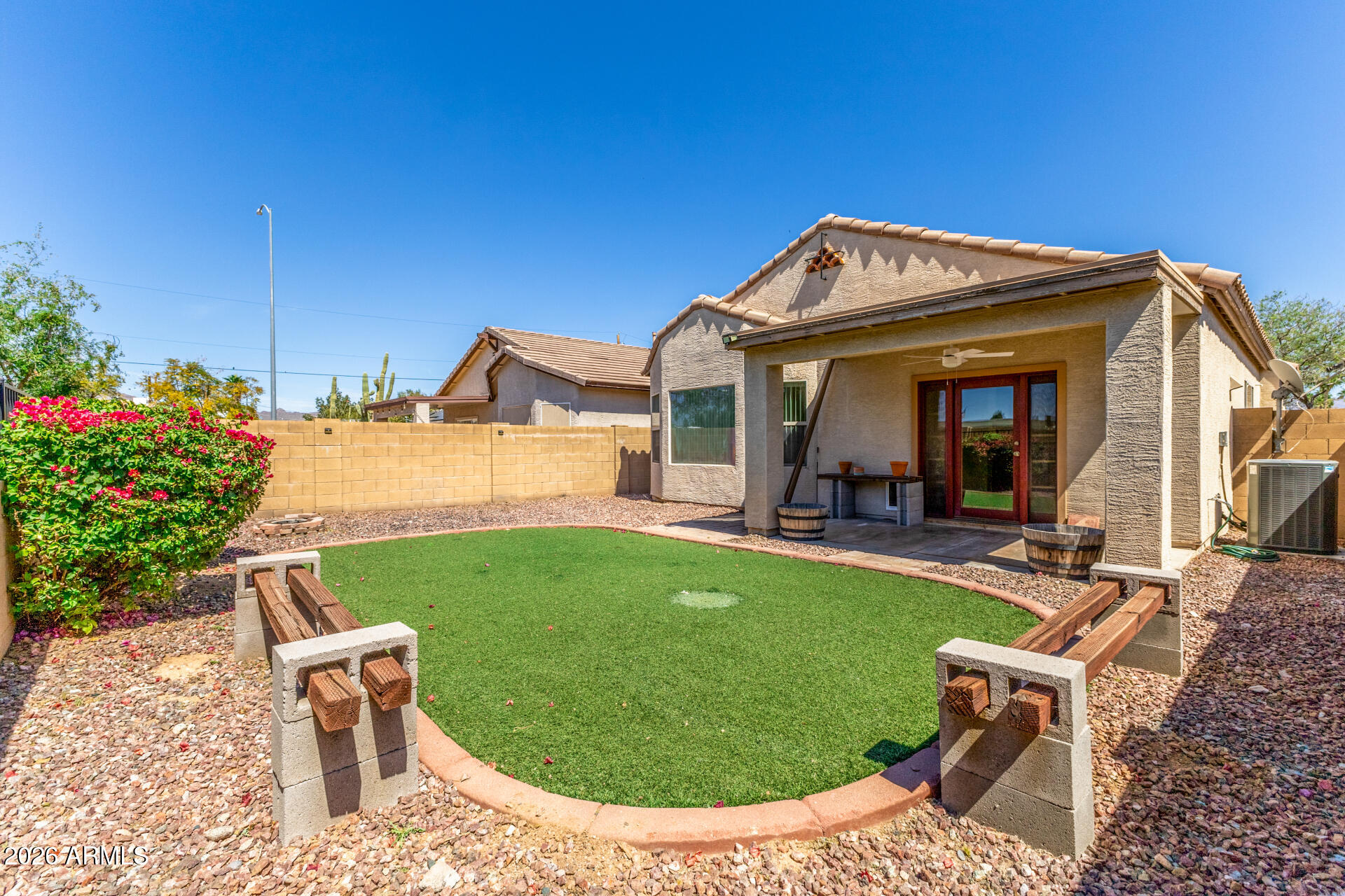 256 North 110th Street Apache Junction, AZ 85120 - Photo 23 of 27 a view of a patio with table and chairs potted plants