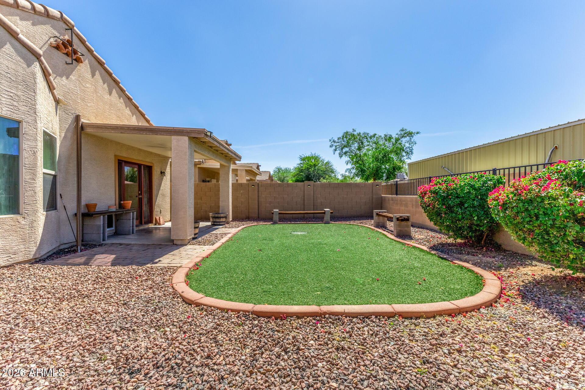256 North 110th Street Apache Junction, AZ 85120 - Photo 26 of 27 a view of a house with backyard and garden