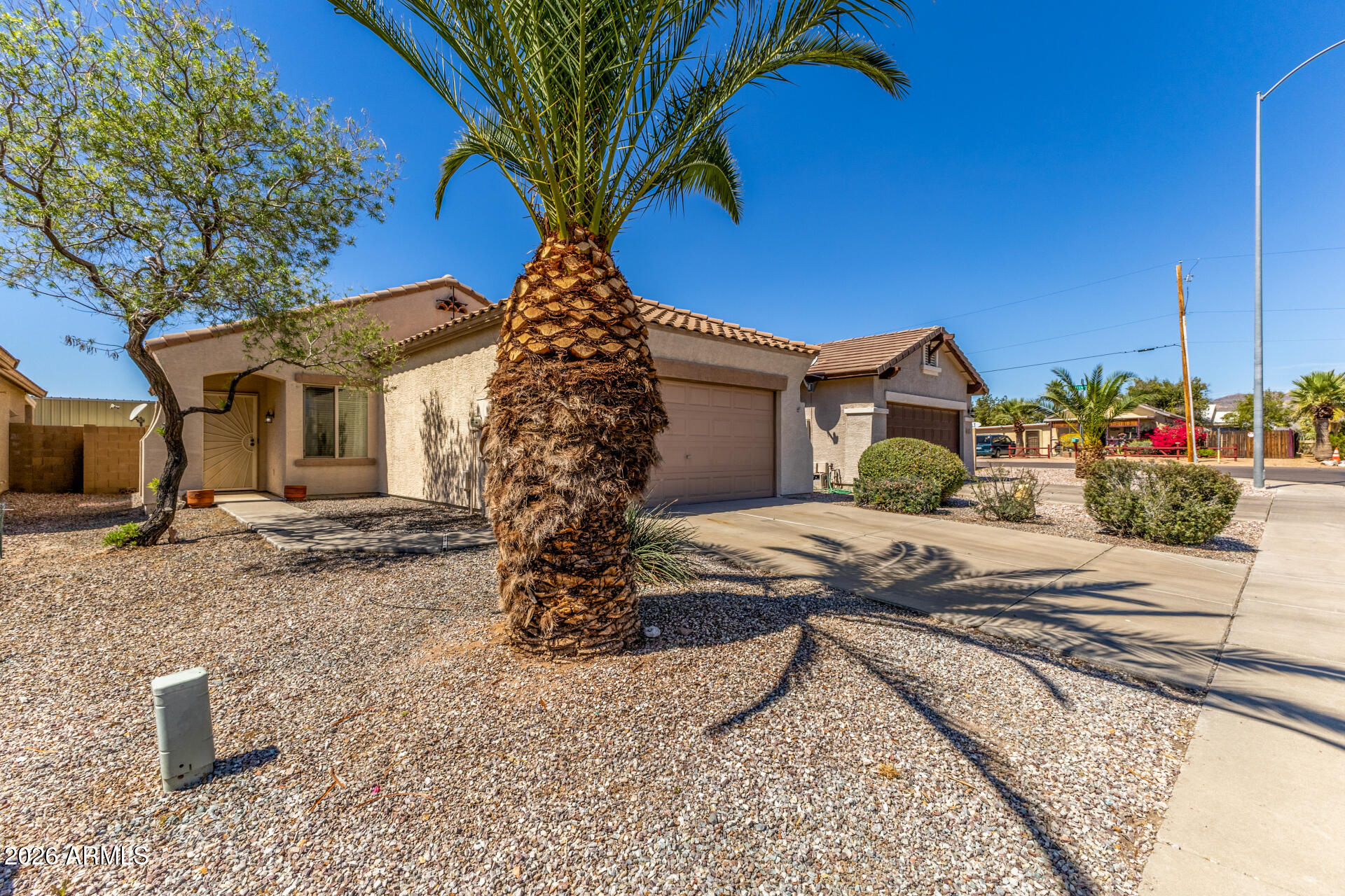 256 North 110th Street Apache Junction, AZ 85120 - Photo 3 of 27 a front view of a house with garden