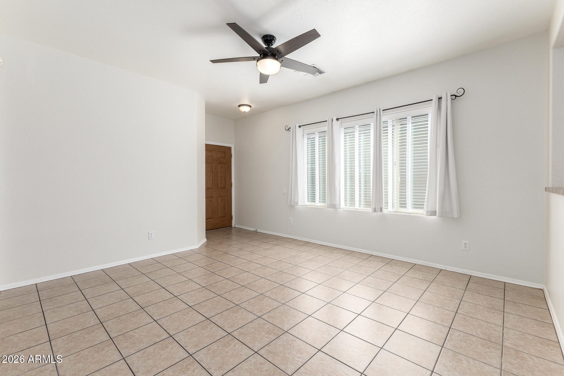 256 North 110th Street Apache Junction, AZ 85120 - Photo 5 of 27 a view of an empty room with a window