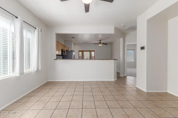 a view of a kitchen with furniture and windows