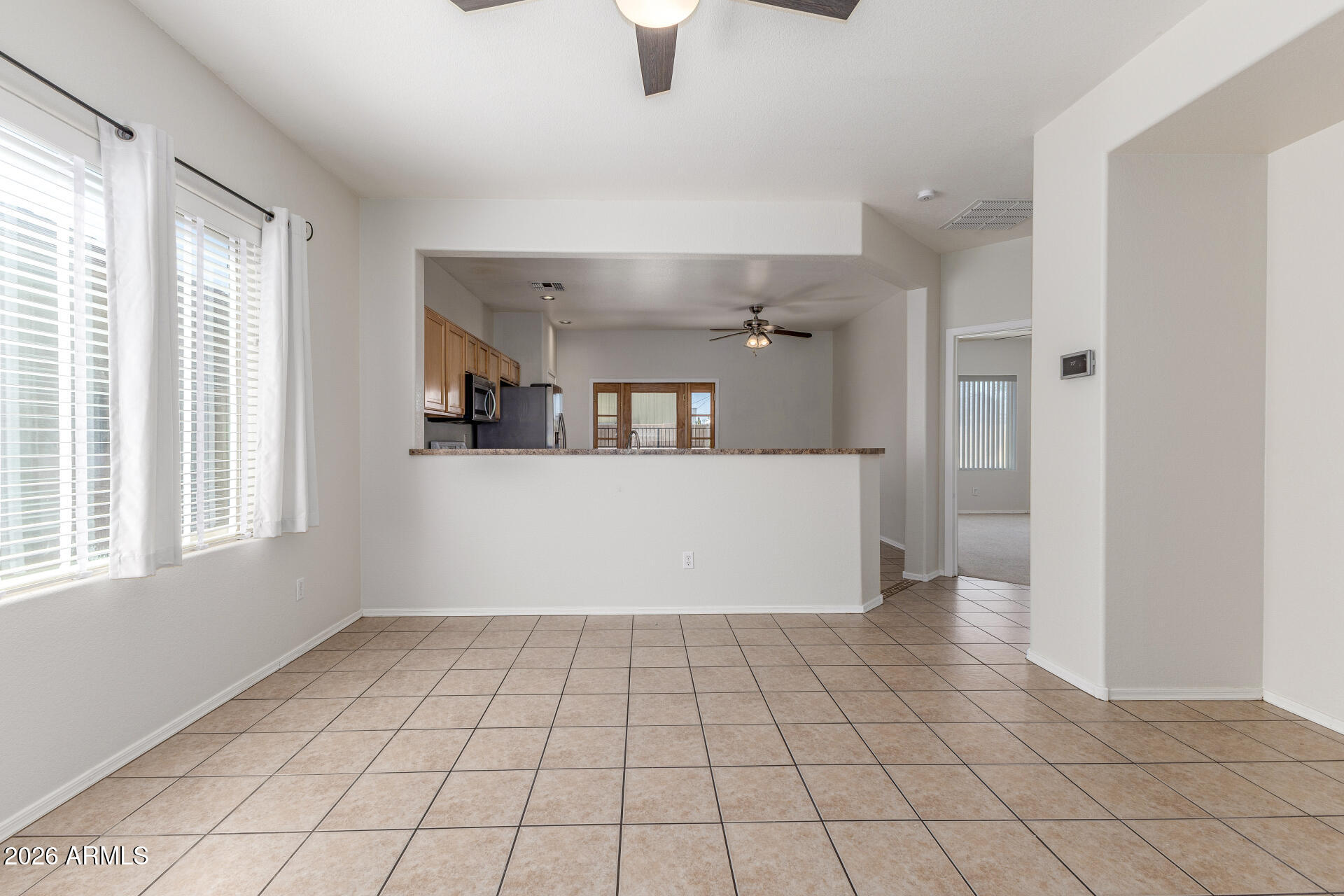 256 North 110th Street Apache Junction, AZ 85120 - Photo 6 of 27 a view of a kitchen with furniture and windows