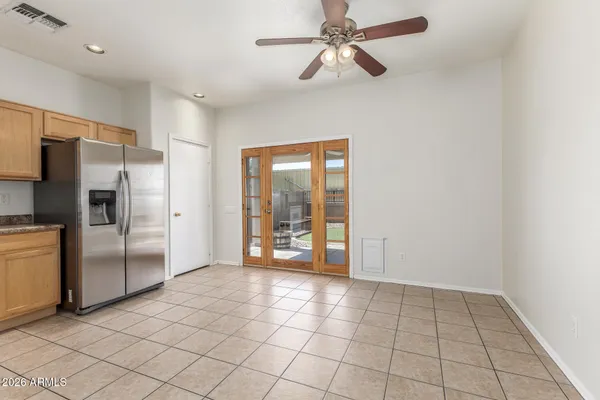 a view of a kitchen with a sink and a refrigerator