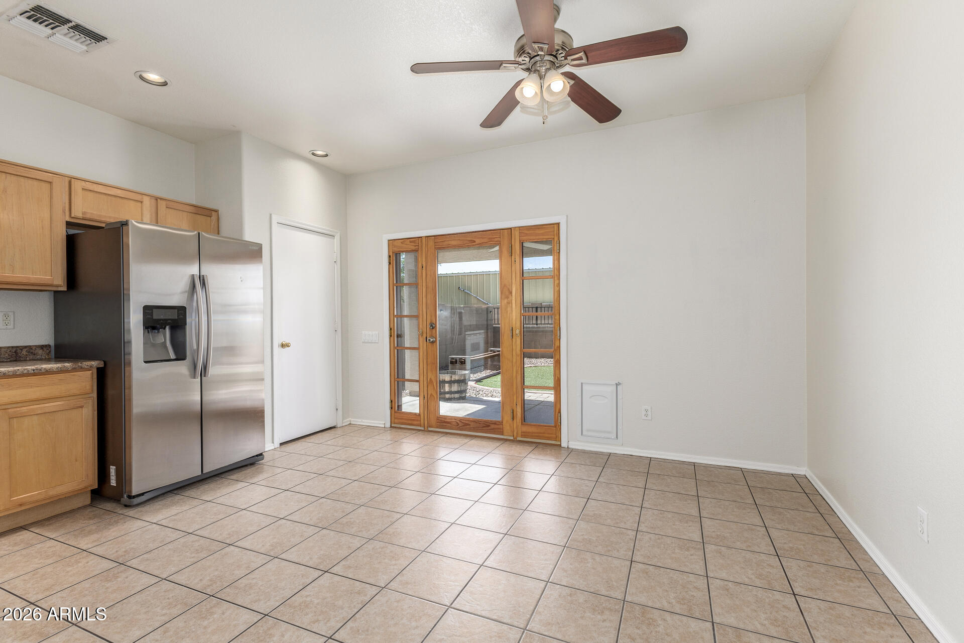 256 North 110th Street Apache Junction, AZ 85120 - Photo 7 of 27 a view of a kitchen with a sink and a refrigerator