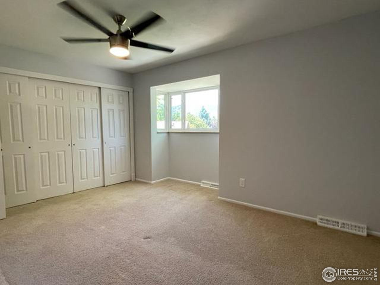 2661 Lloyd Circle Boulder, CO 80304 - Photo 20 of 28 an empty room with windows and fan