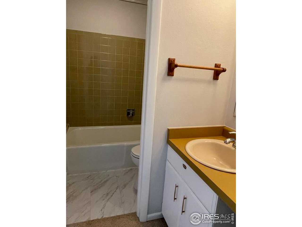 2661 Lloyd Circle Boulder, CO 80304 - Photo 23 of 28 a bathroom with a granite countertop sink a bathtub and a shower