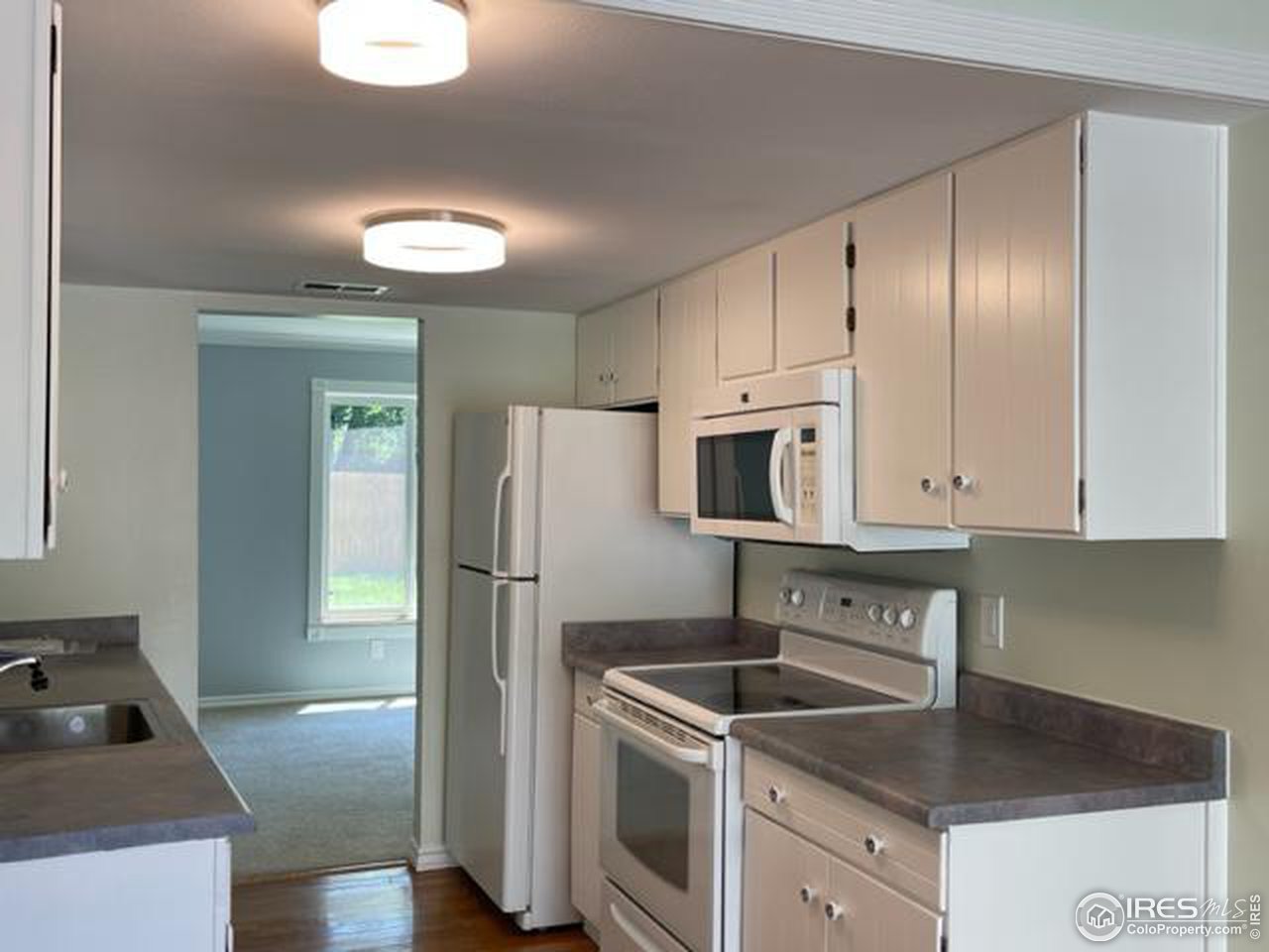 2661 Lloyd Circle Boulder, CO 80304 - Photo 7 of 28 a kitchen with stainless steel appliances granite countertop a refrigerator sink and stove