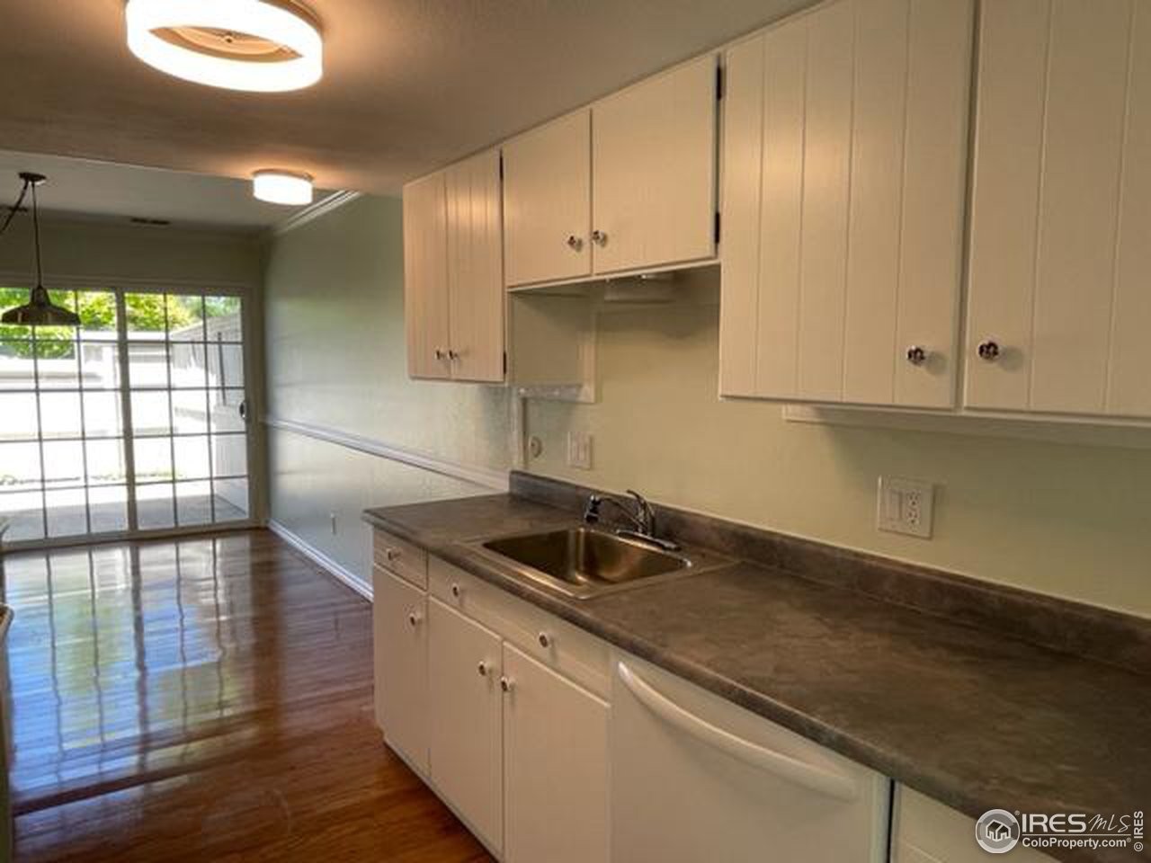 2661 Lloyd Circle Boulder, CO 80304 - Photo 9 of 28 a kitchen with granite countertop white cabinets and a sink