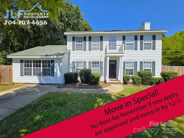 a view of a house with a yard porch and sitting area