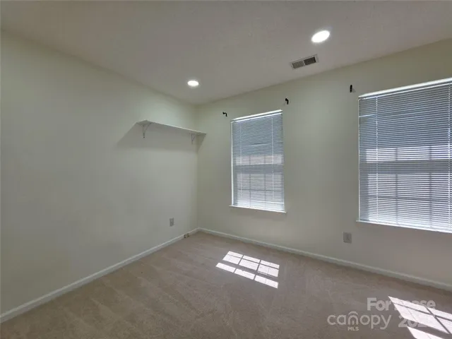 a view of empty room with windows