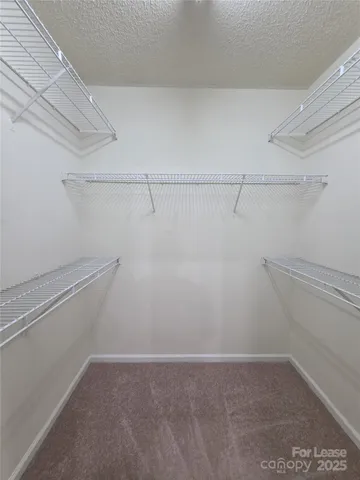 a view of a room with racks on the wall