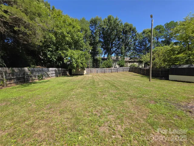 a view of a field with of trees