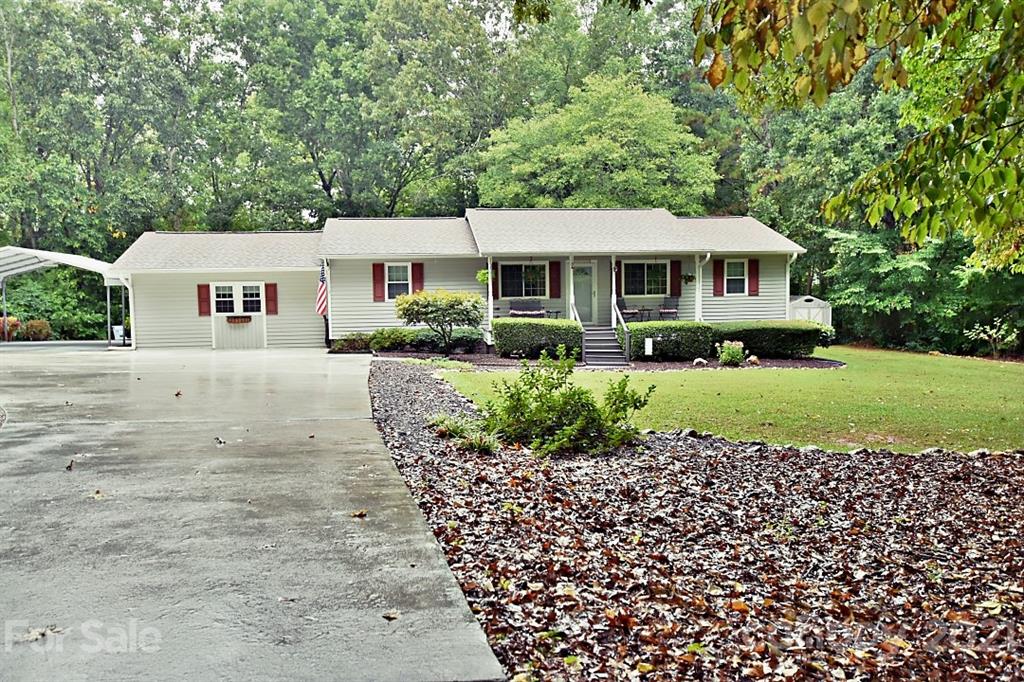 407 Laurel Hills Road Indian Land, SC 29707 - Photo 1 of 26 a front view of a house with a garden