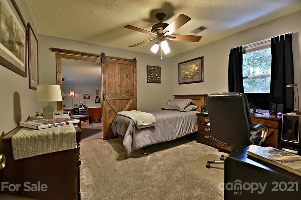 407 Laurel Hills Road Indian Land, SC 29707 - Photo 17 of 26 a bedroom with bed and window