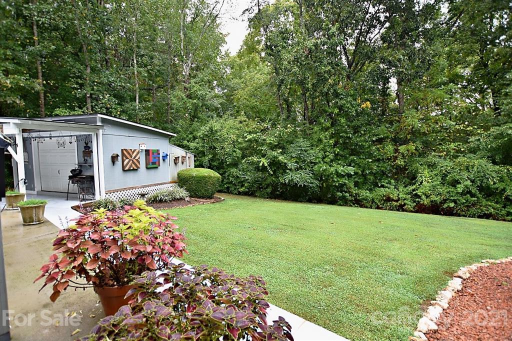 407 Laurel Hills Road Indian Land, SC 29707 - Photo 23 of 26 a front view of a house with garden