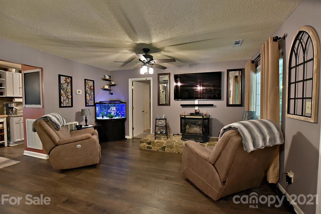 407 Laurel Hills Road Indian Land, SC 29707 - Photo 5 of 26 a living room with furniture and a flat screen tv