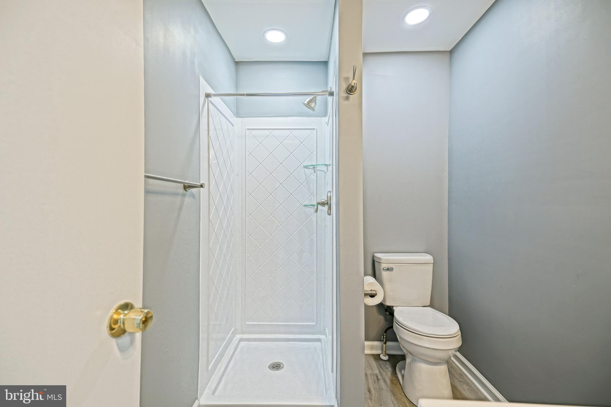 110 West 3rd Street Lewes, DE 19958 - Photo 17 of 28 a bathroom with a toilet and shower