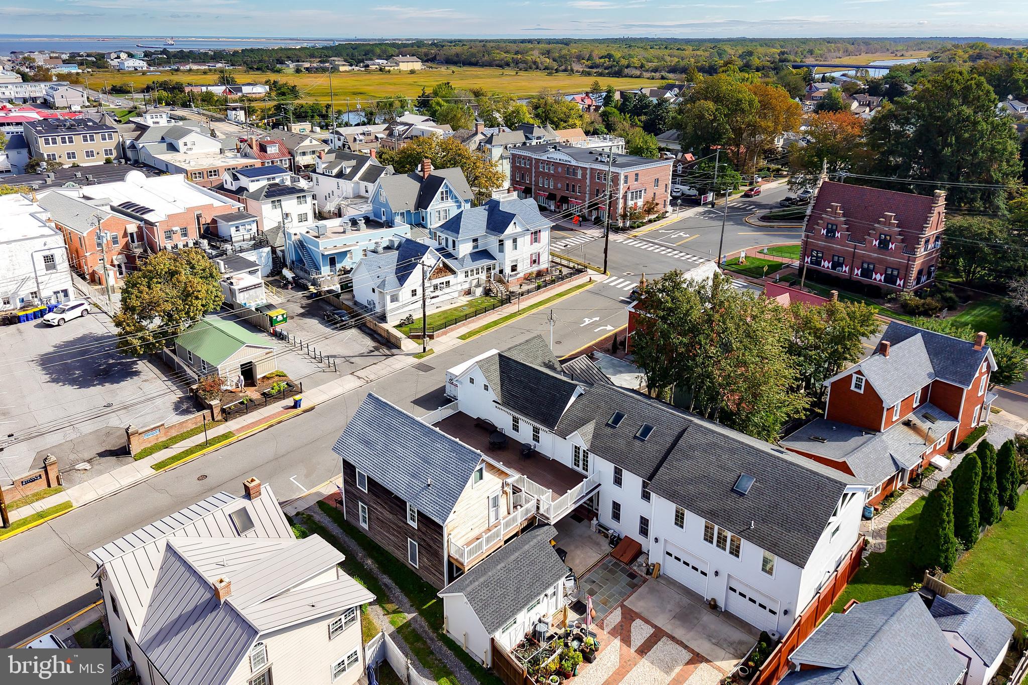 110 West 3rd Street Lewes, DE 19958 - Photo 26 of 28 an aerial view of a house with a swimming pool outdoor seating and yard view