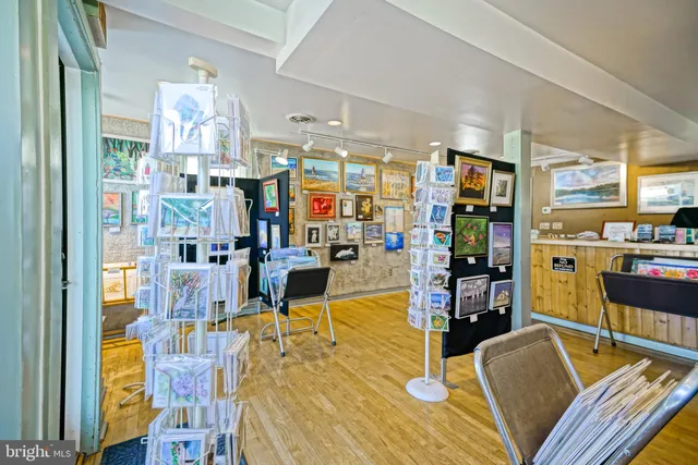 a living room with lots of furniture and kitchen view