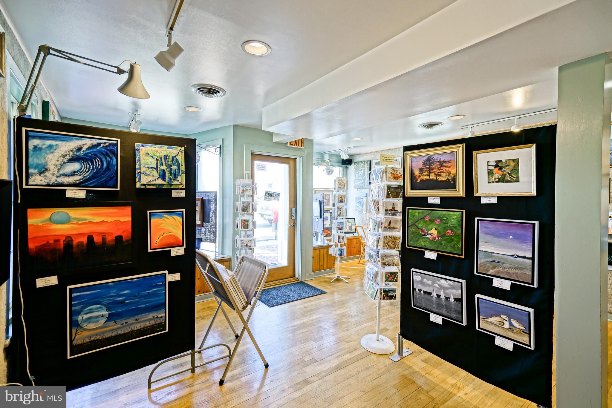 110 West 3rd Street Lewes, DE 19958 - Photo 6 of 28 a living room with furniture a flat screen tv and a fireplace